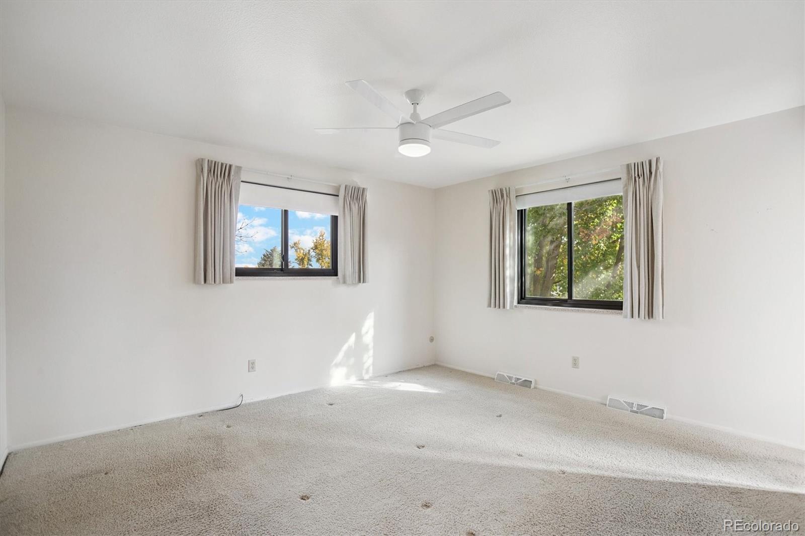 6193 South Jackson Street Centennial, CO 80121 - Photo 16 of 31 an empty room with windows
