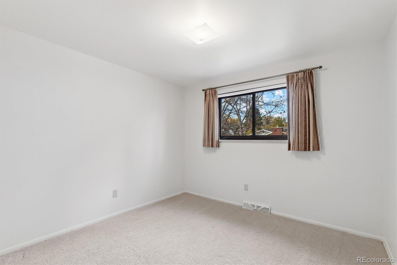 6193 South Jackson Street Centennial, CO 80121 - Photo 20 of 31 an empty room with a window