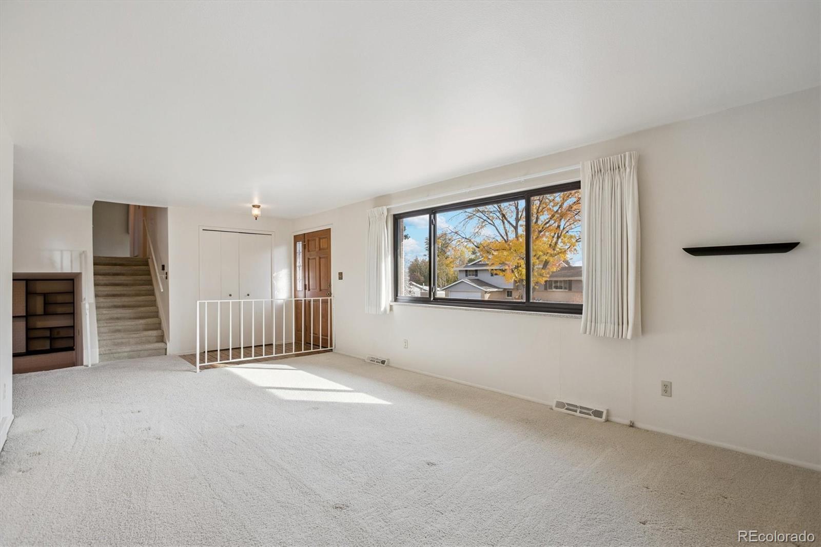 6193 South Jackson Street Centennial, CO 80121 - Photo 4 of 31 an empty room with windows