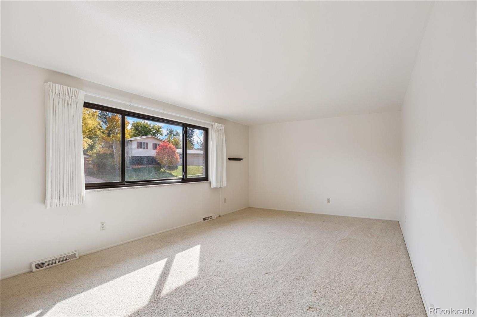 6193 South Jackson Street Centennial, CO 80121 - Photo 8 of 31 an empty room with windows
