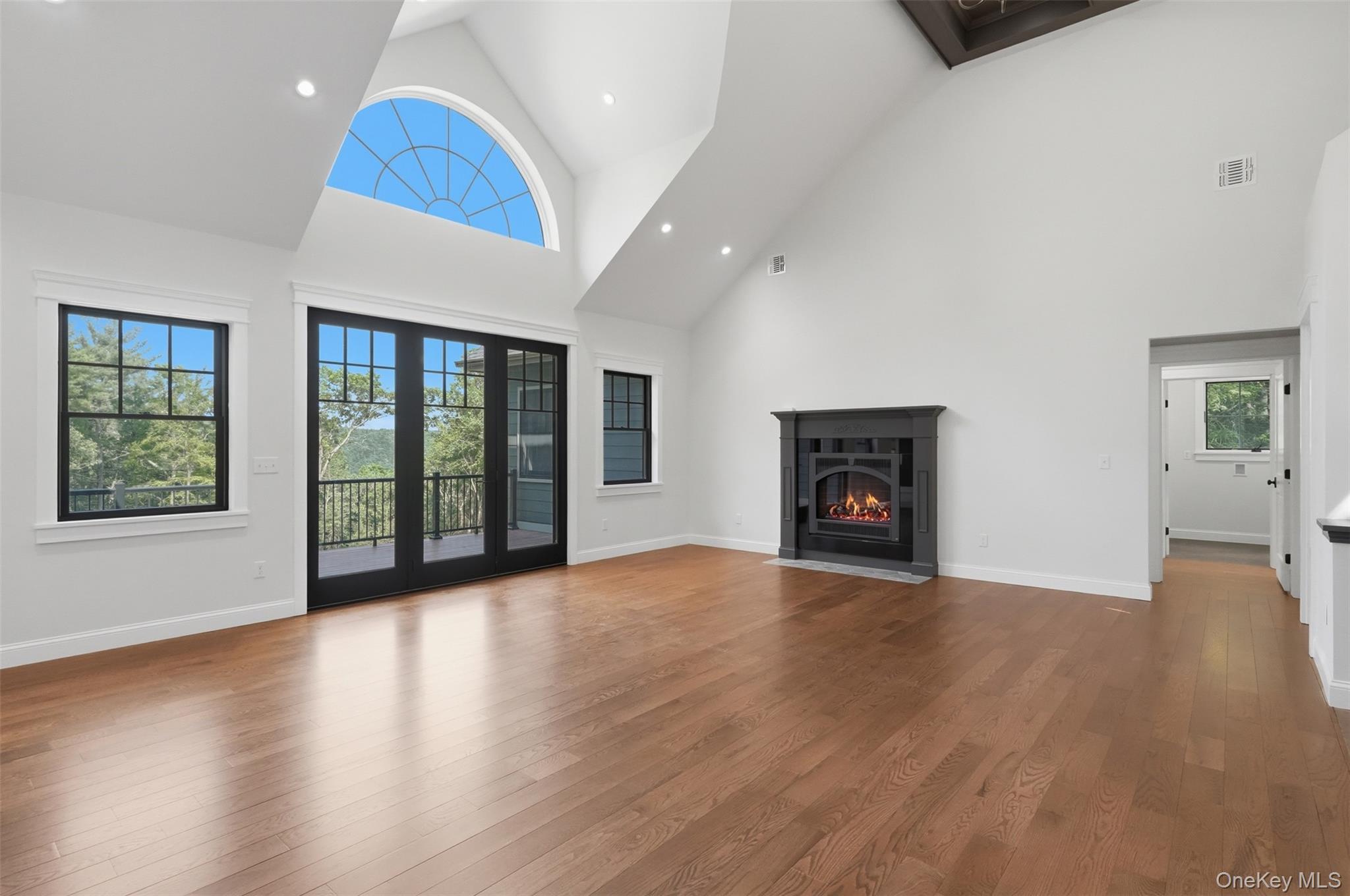 300 Van Tuyl Road Barryville, NY 12719 - Photo 24 of 50 a view of an empty room with wooden floor and a window