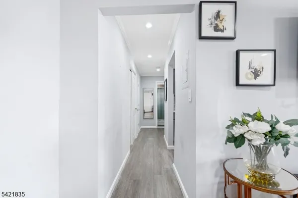 a view of a hallway with flower pot