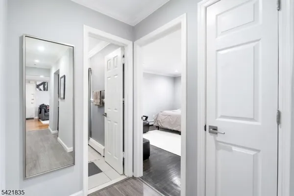 a view of a bathroom from a hallway