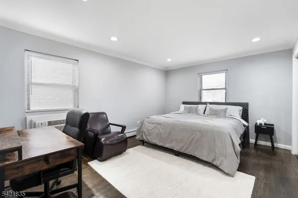 a bedroom with a bed and a table