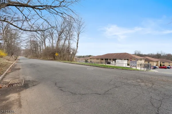 a view of a road with a building in the background