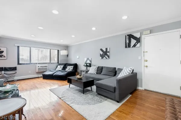 a living room with furniture and a rug