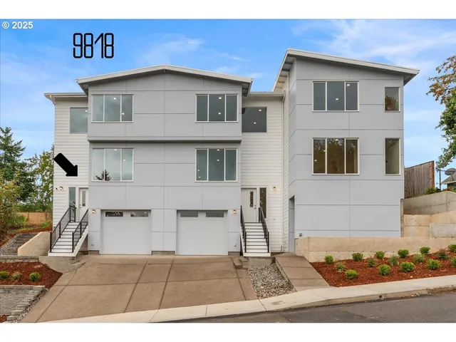 a view of a house with wooden fence