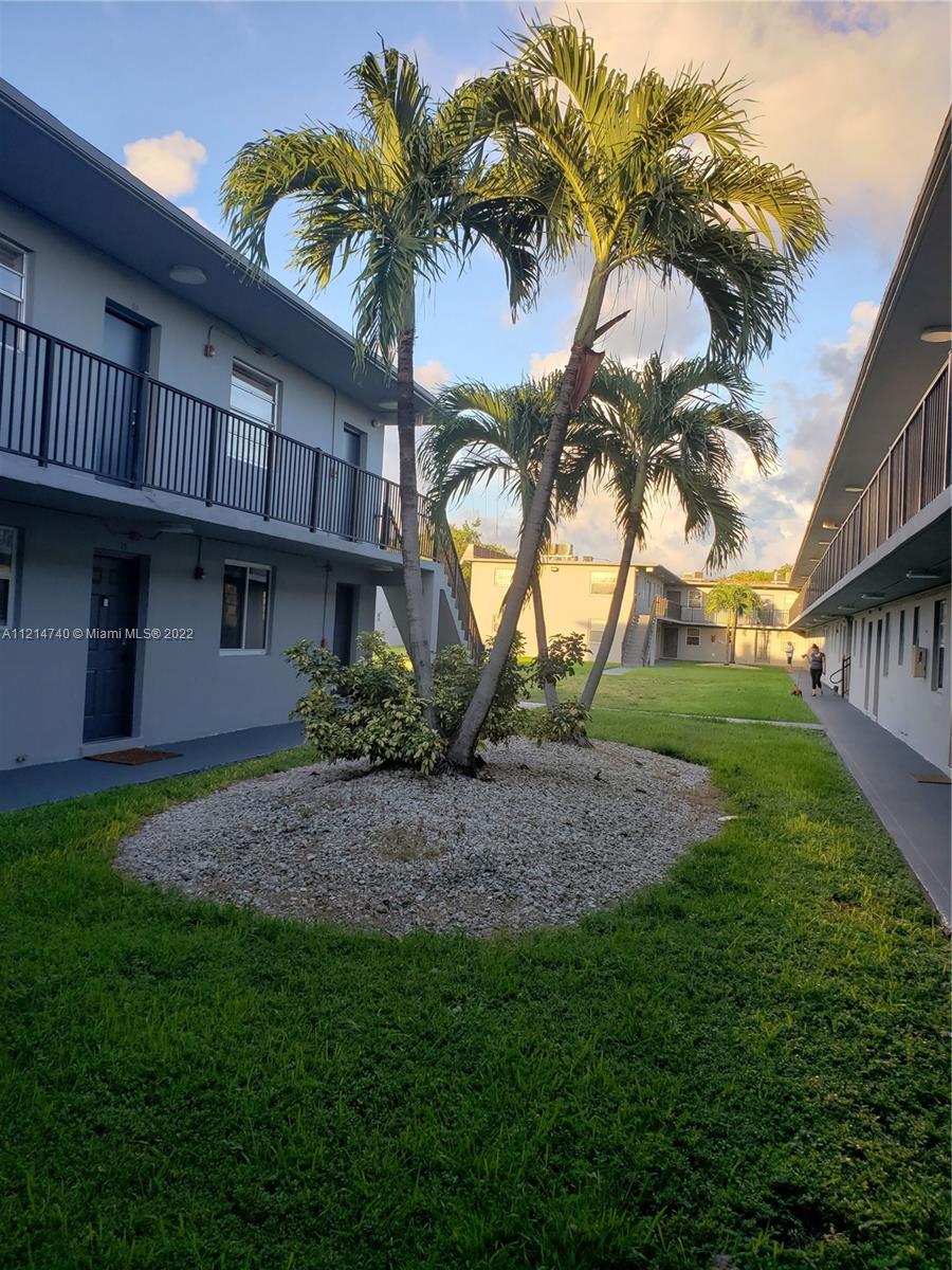 4300 Southwest 67th Avenue, Unit 30 Miami, FL 33155 - Photo 2 of 2 a front view of a house with a garden