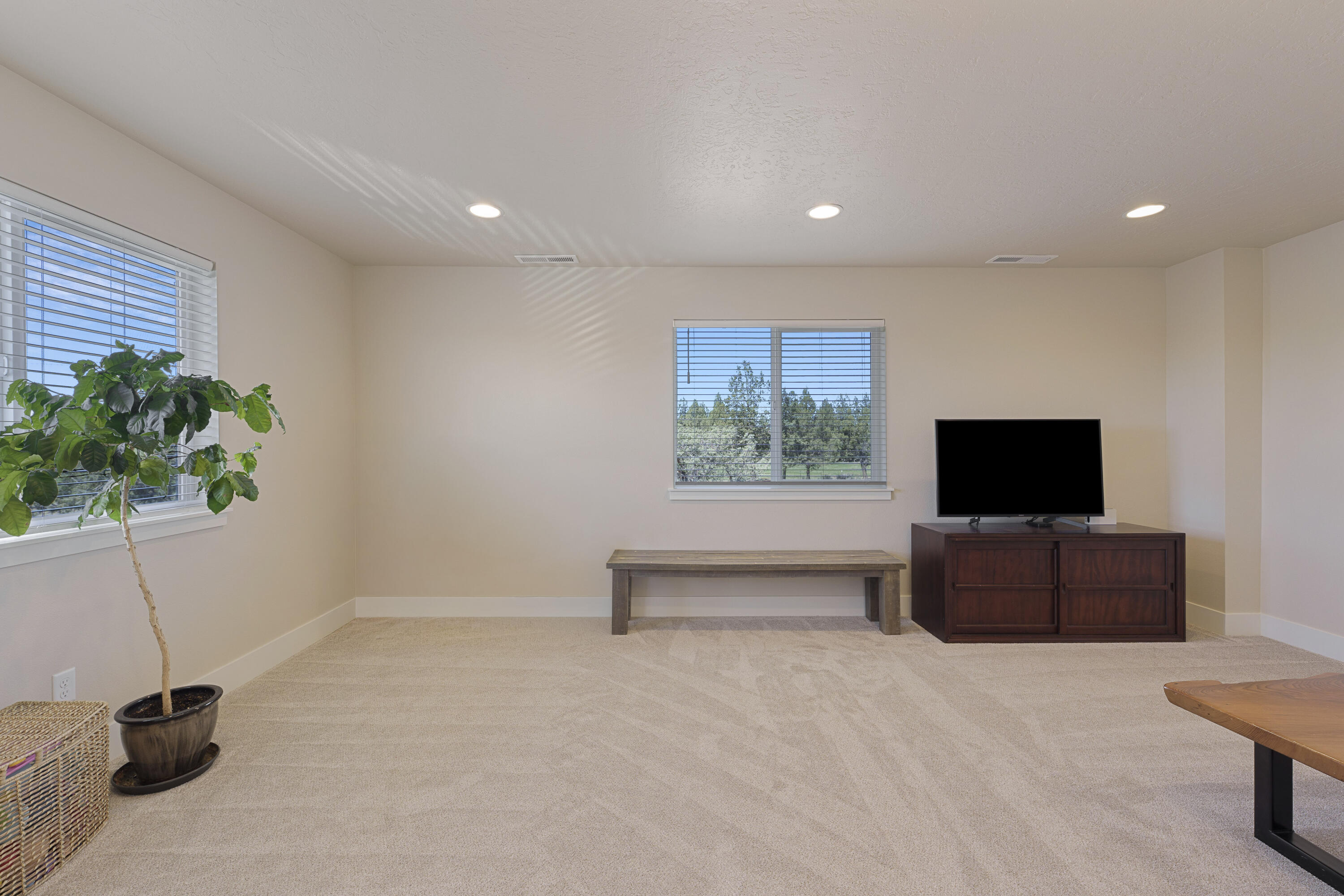 4999 Southwest Yew Place Redmond, OR 97756 - Photo 26 of 50 a living room with furniture and a flat screen tv