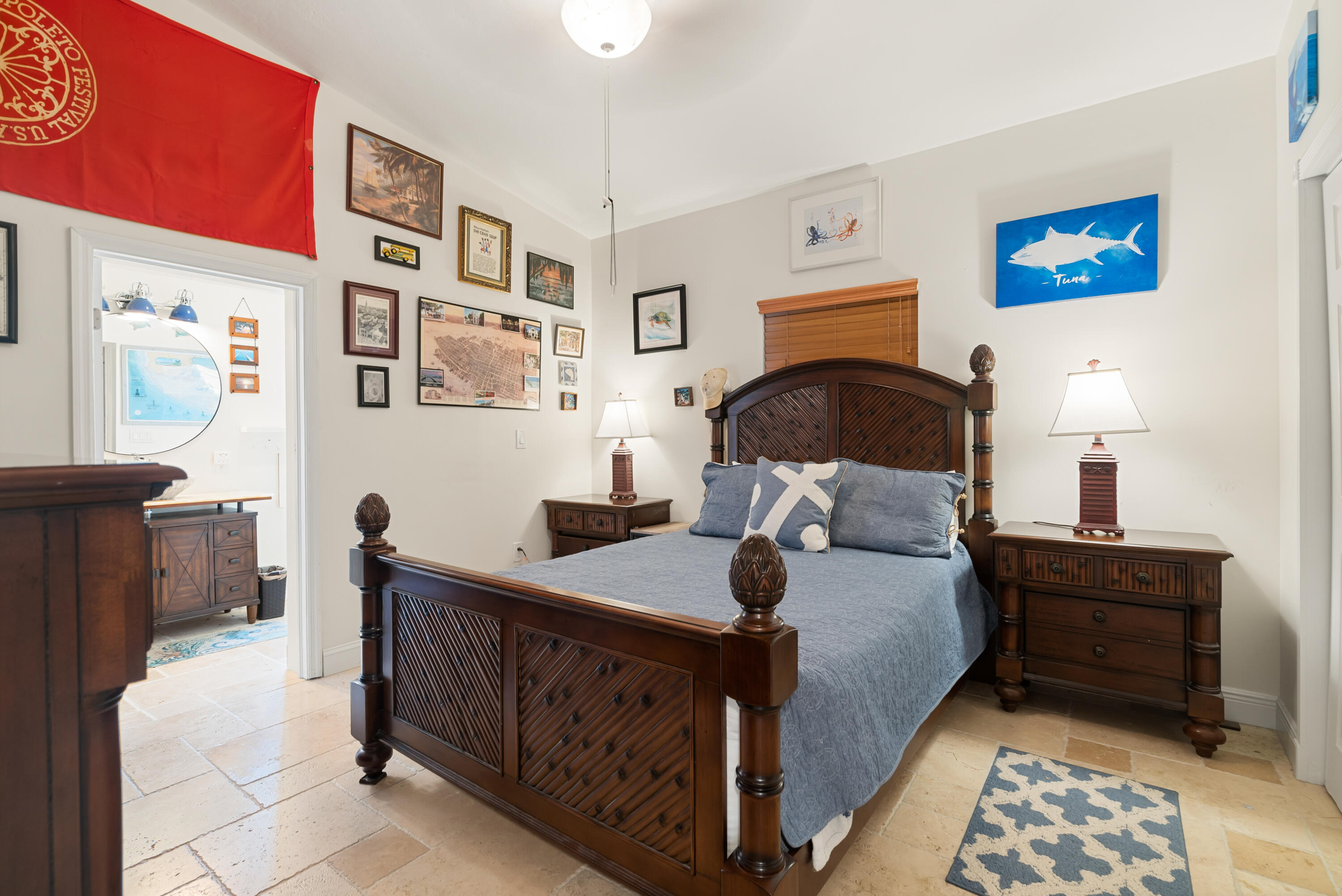 311 Buttonwood Circle Key Largo, FL 33037 - Photo 13 of 38 a bedroom with a bed and wooden floor