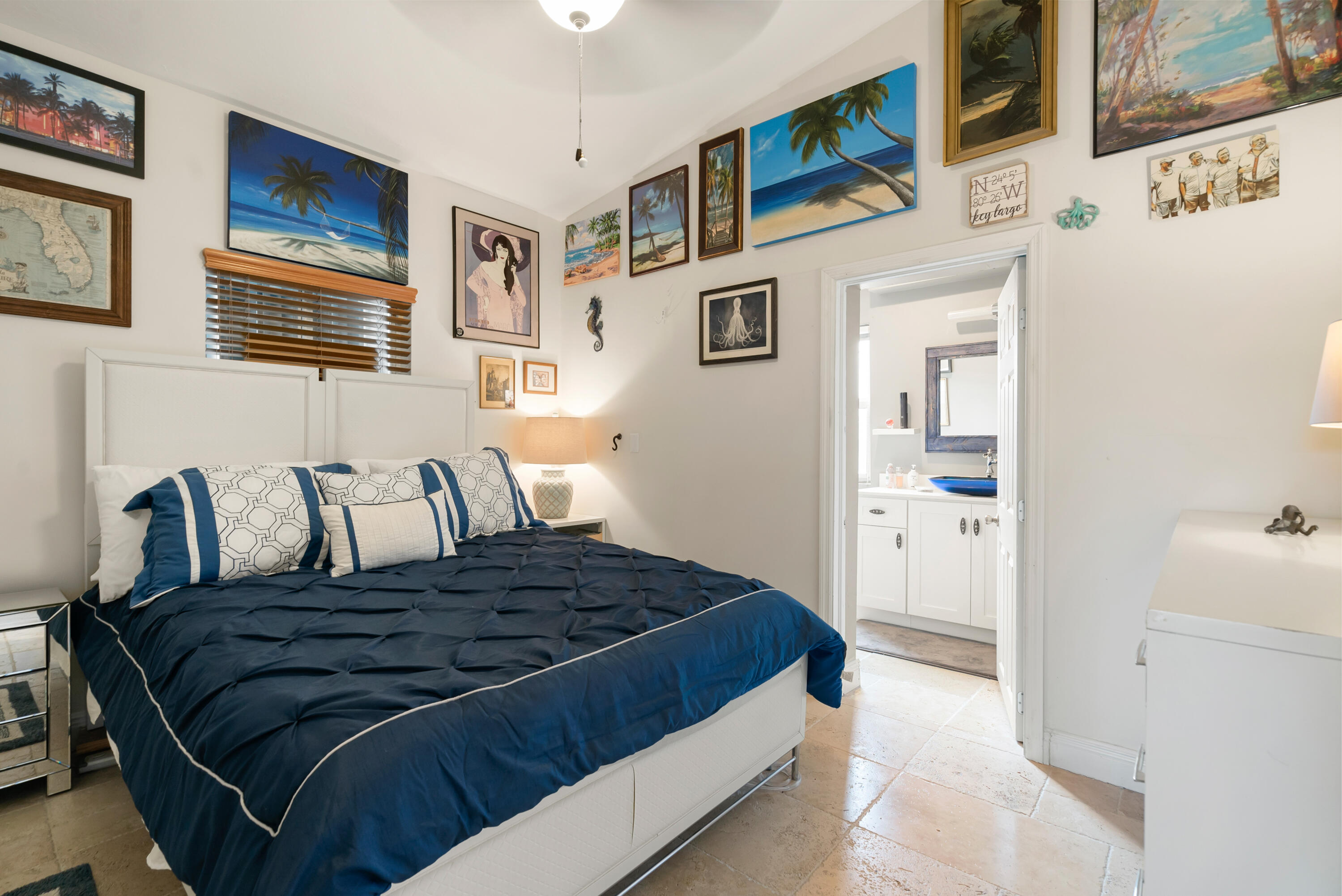 311 Buttonwood Circle Key Largo, FL 33037 - Photo 17 of 38 a bedroom with a large bed and a window