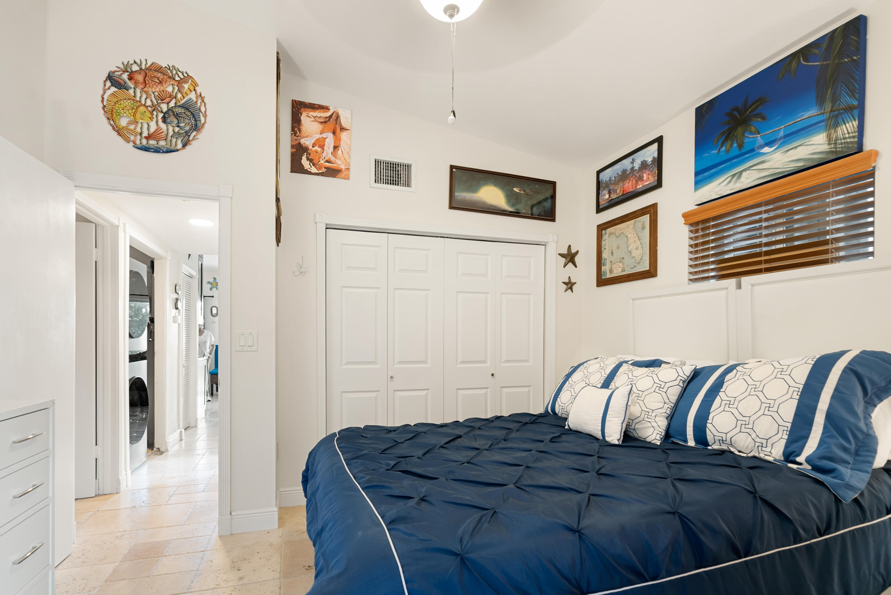 311 Buttonwood Circle Key Largo, FL 33037 - Photo 18 of 38 a bedroom with a bed and cupboard