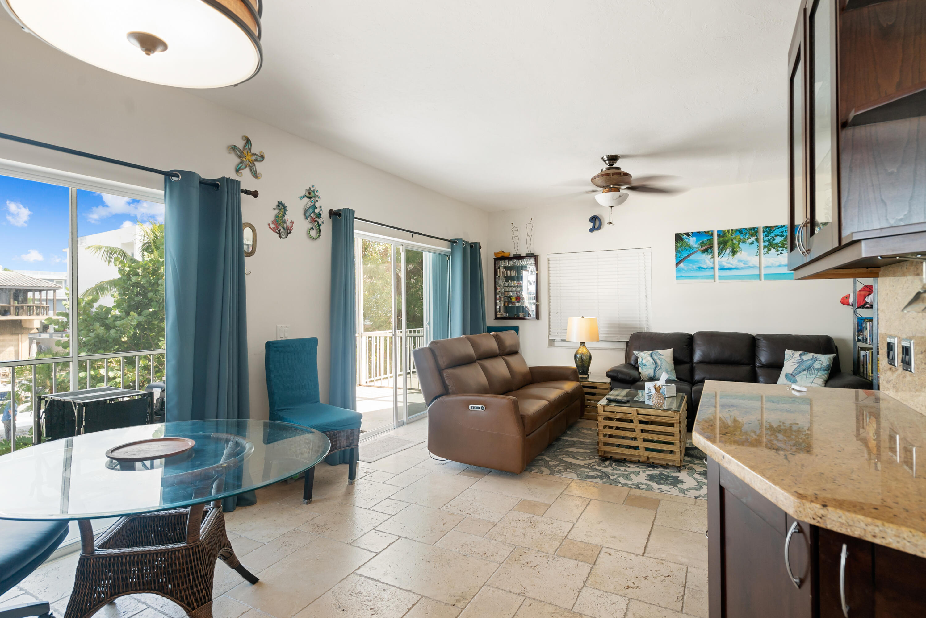311 Buttonwood Circle Key Largo, FL 33037 - Photo 22 of 38 a living room with fireplace furniture and a large window