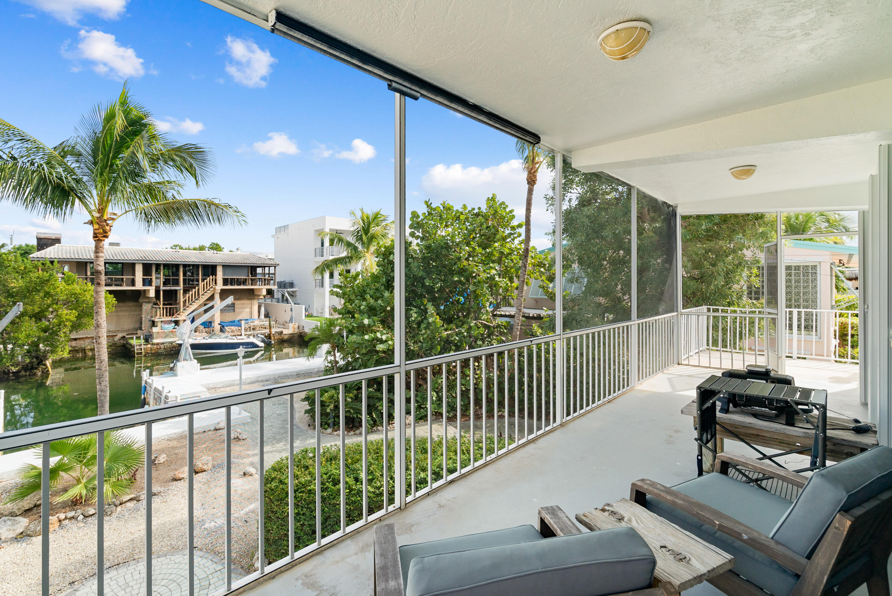 311 Buttonwood Circle Key Largo, FL 33037 - Photo 23 of 38 a view of a balcony with furniture