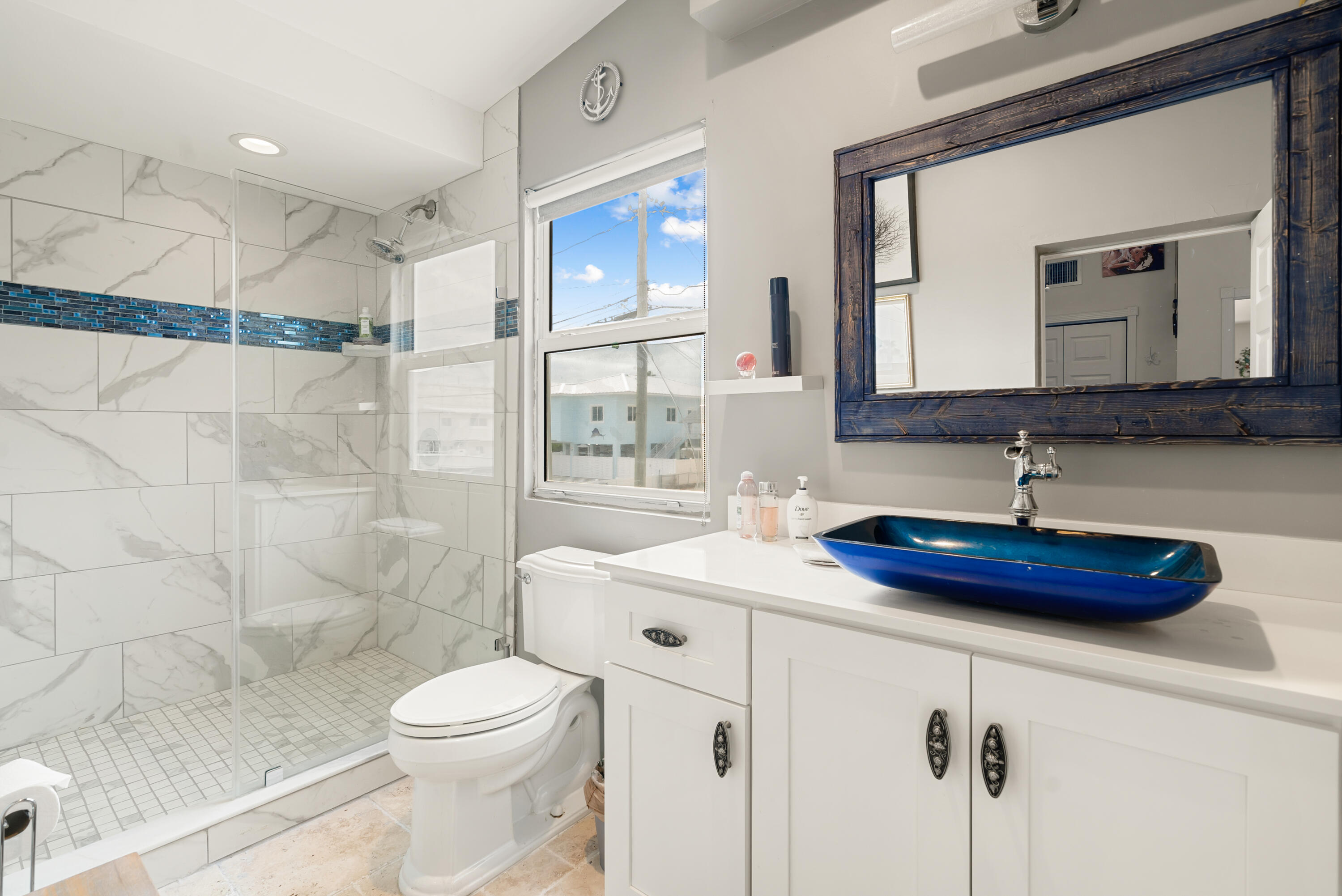 311 Buttonwood Circle Key Largo, FL 33037 - Photo 29 of 38 a bathroom with a sink a toilet and shower