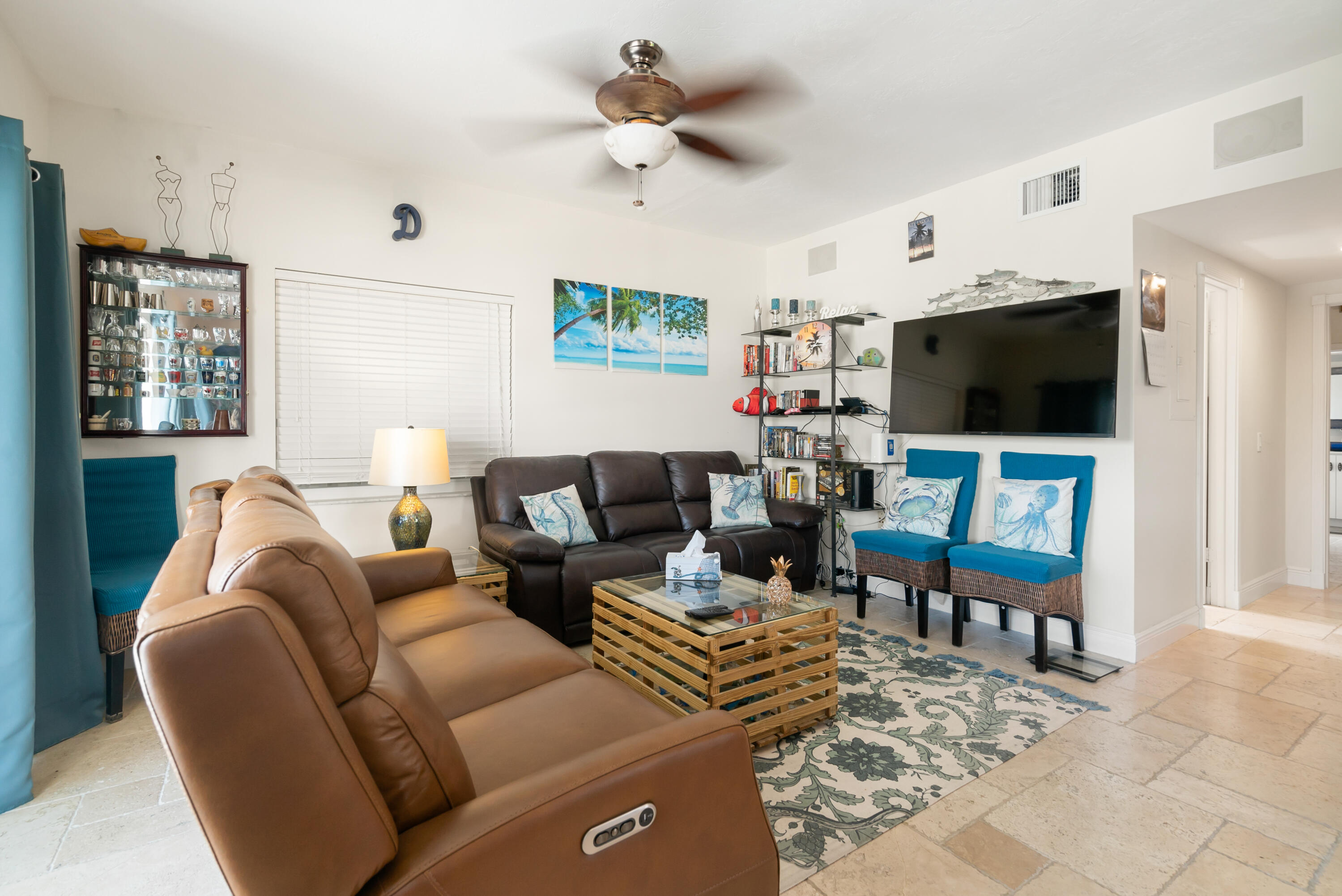 311 Buttonwood Circle Key Largo, FL 33037 - Photo 31 of 38 a living room with furniture a flat screen tv and a window