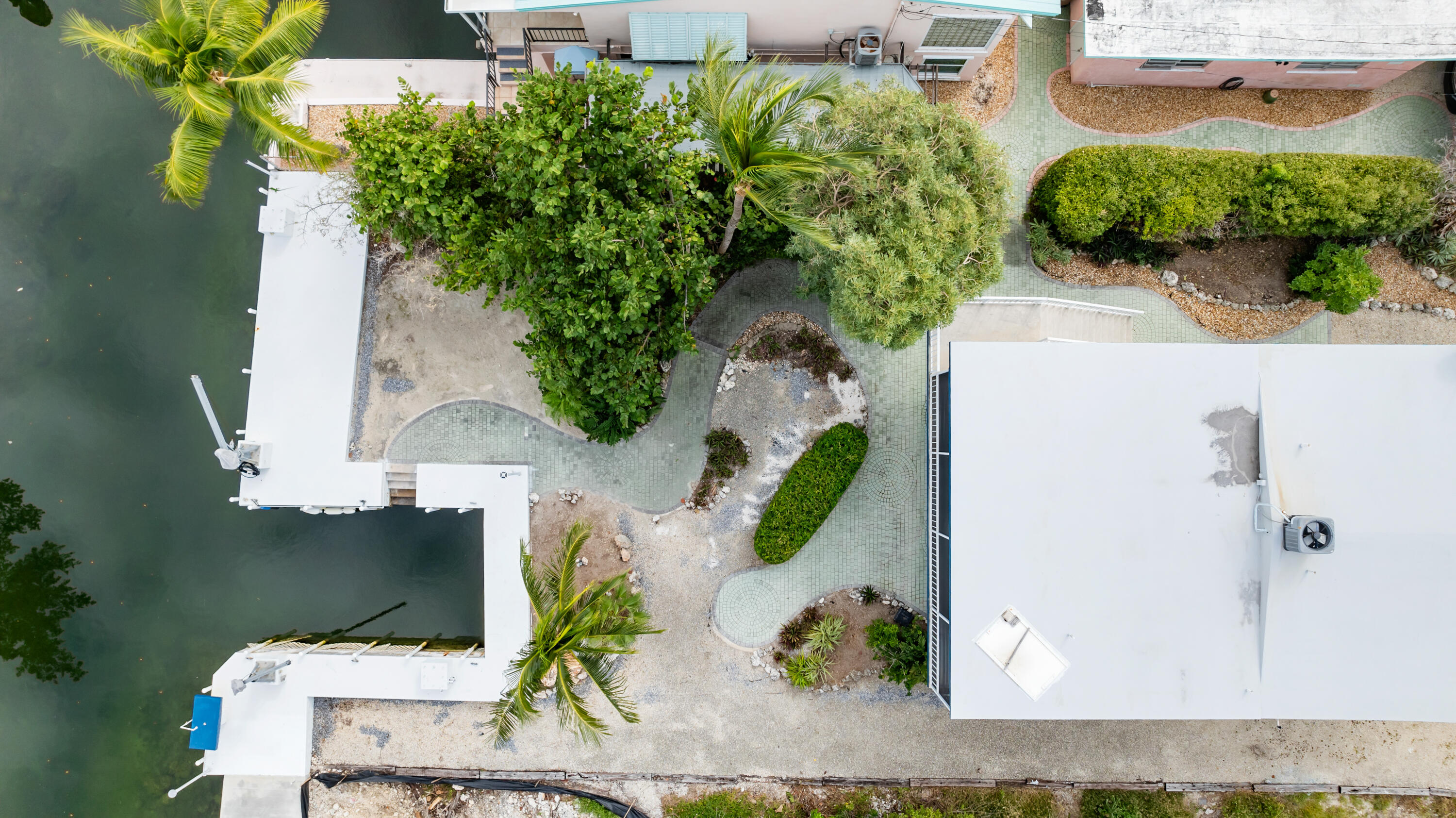 311 Buttonwood Circle Key Largo, FL 33037 - Photo 34 of 38 an aerial view of a house with a yard and garden