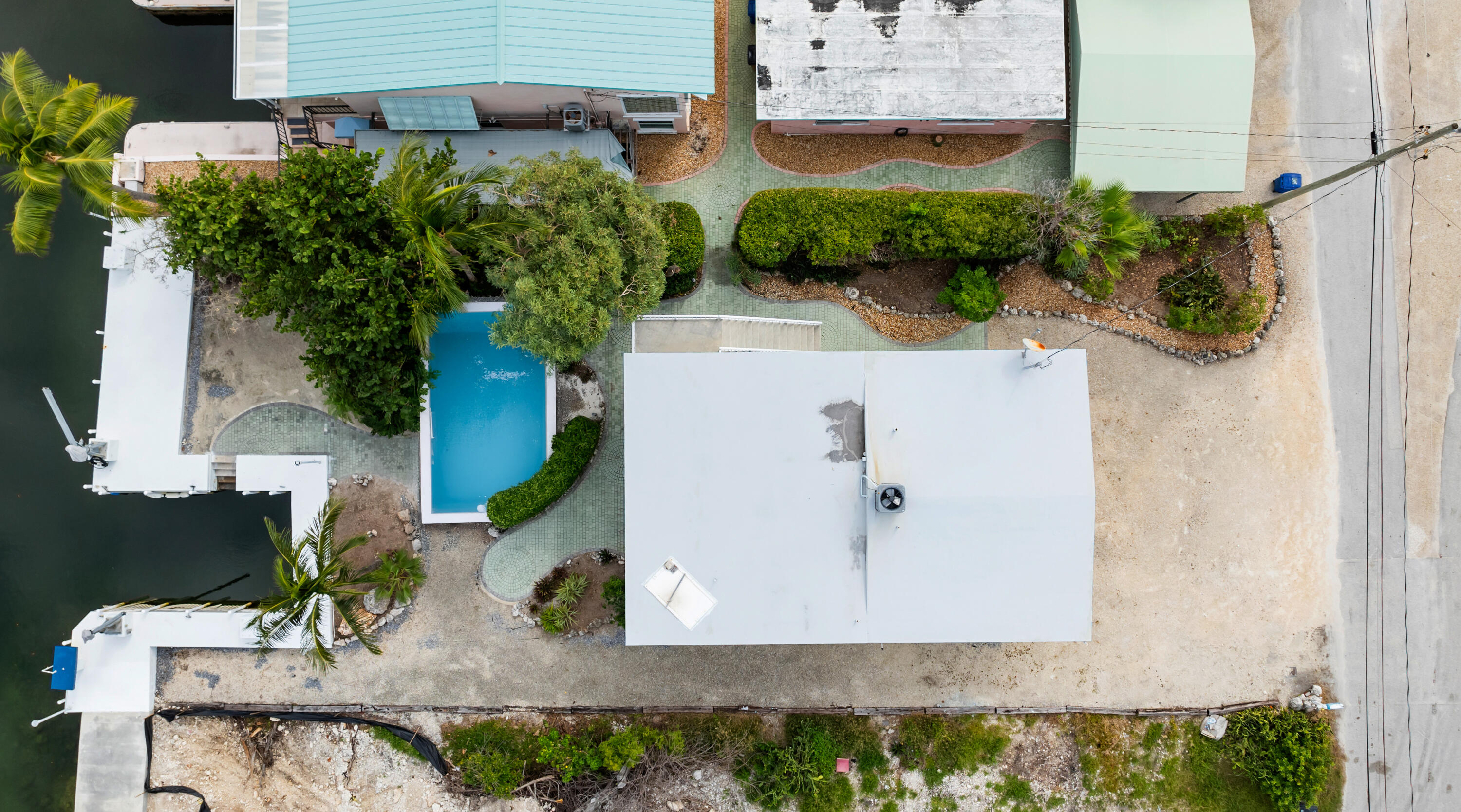 311 Buttonwood Circle Key Largo, FL 33037 - Photo 35 of 38 an aerial view of a house with a yard and potted plants