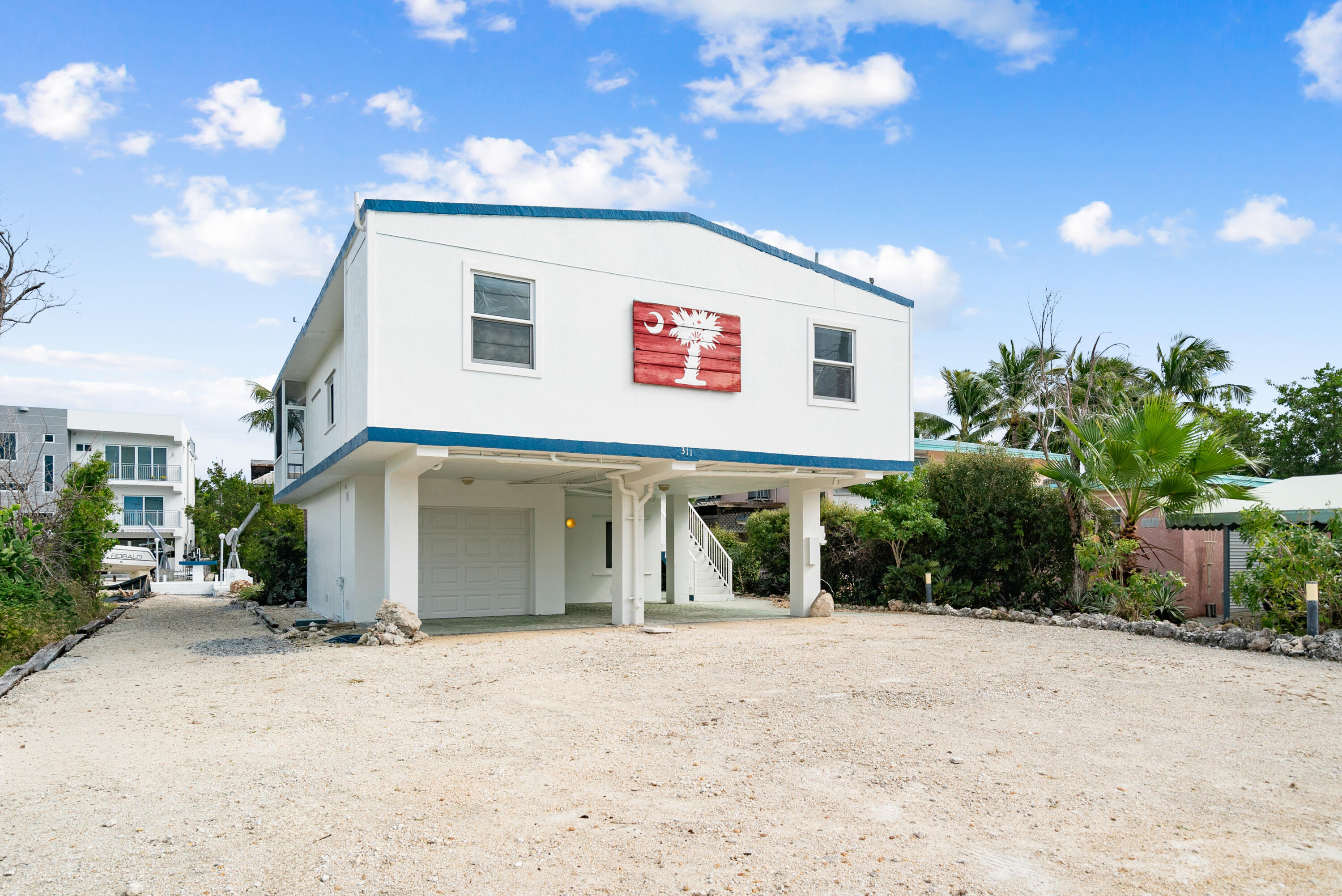 311 Buttonwood Circle Key Largo, FL 33037 - Photo 5 of 38 a view of a house with a yard