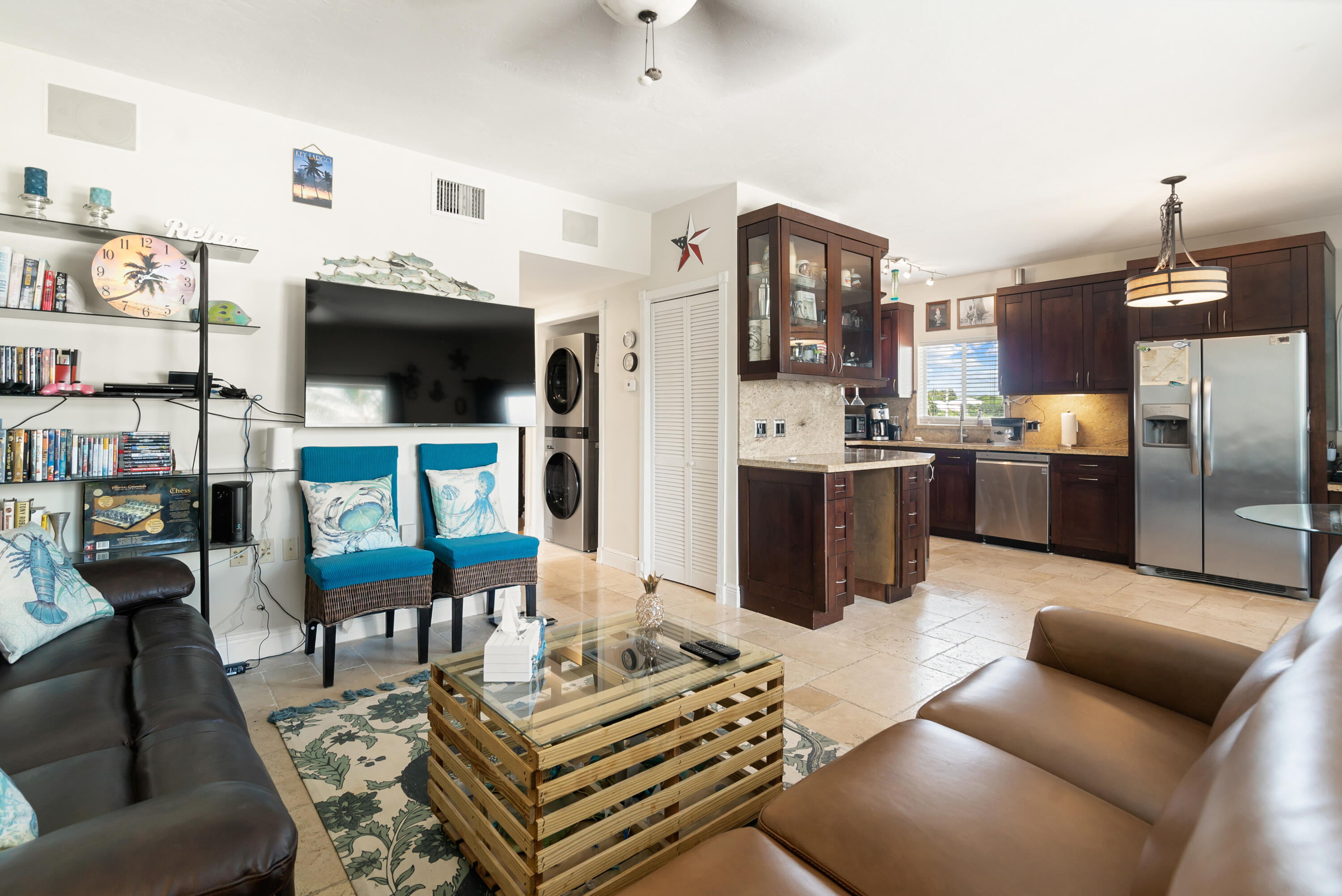 311 Buttonwood Circle Key Largo, FL 33037 - Photo 8 of 38 a living room with fireplace furniture and a flat screen tv