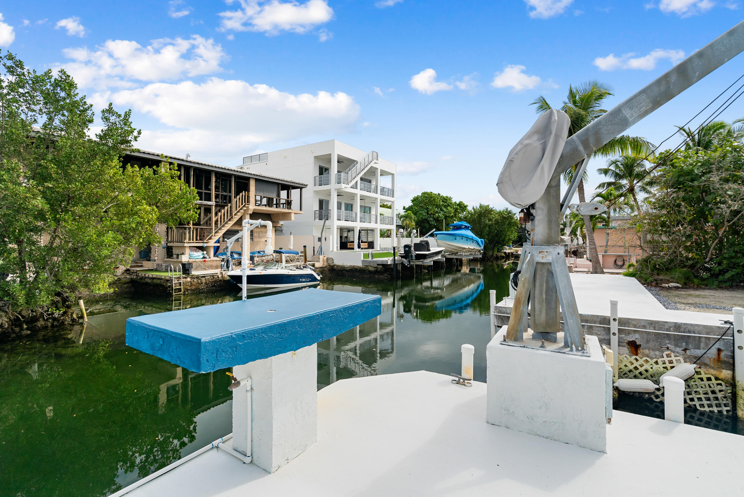 311 Buttonwood Circle Key Largo, FL 33037 - Photo 8 of 38 a view of multiple houses with a yard