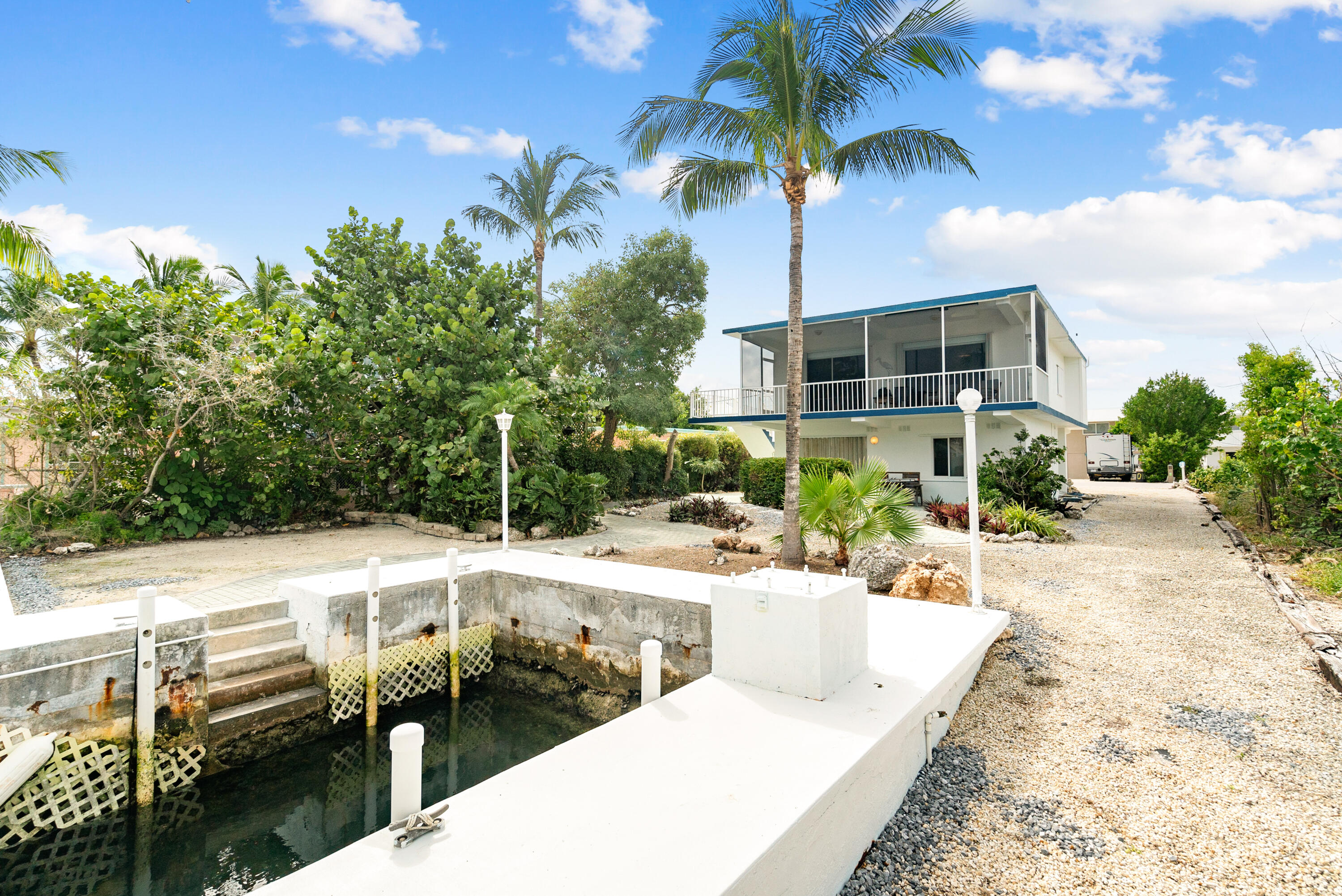 311 Buttonwood Circle Key Largo, FL 33037 - Photo 9 of 38 a view of a patio with swimming pool