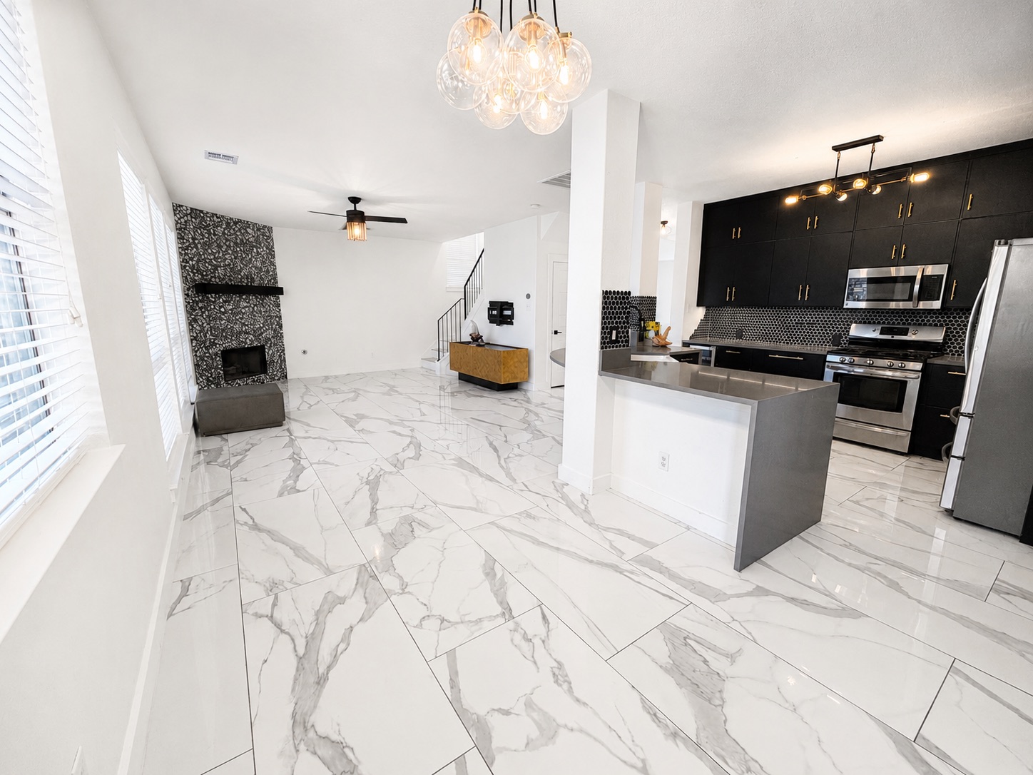 1610 Juniper Ridge Loop Cedar Park, TX 78613 - Photo 5 of 28 Polished tile flooring flows seamlessly through this open-concept layout connecting the kitchen and living areas.