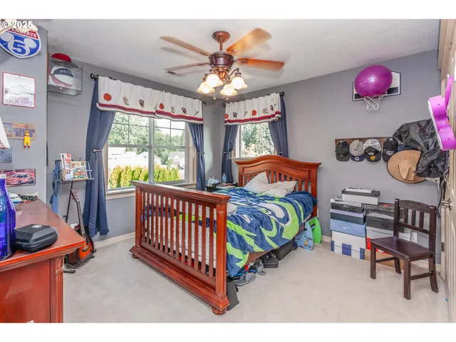 a bedroom with furniture and a window