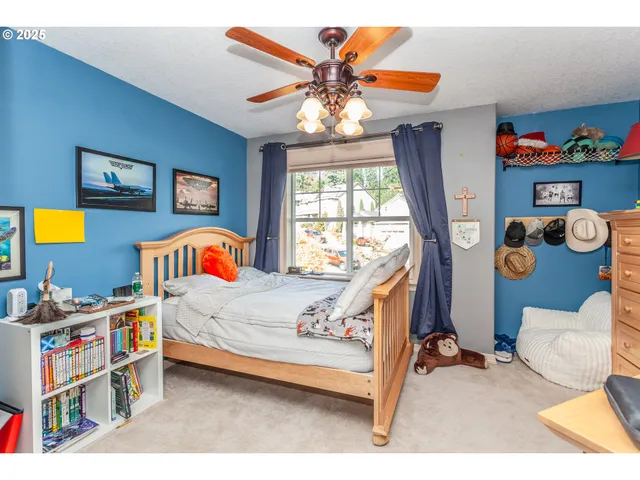 a bedroom with furniture and a window