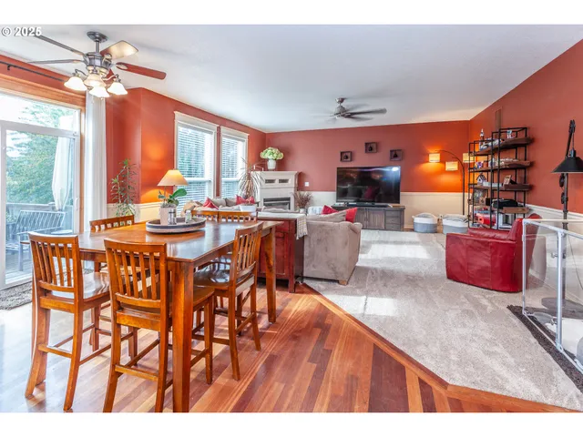 a view of a dining room with furniture wooden floor and chandelier