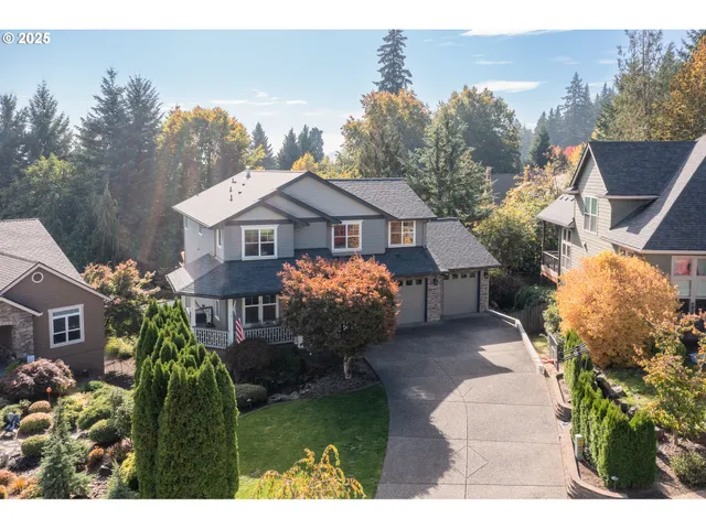 a house with green field in front of it