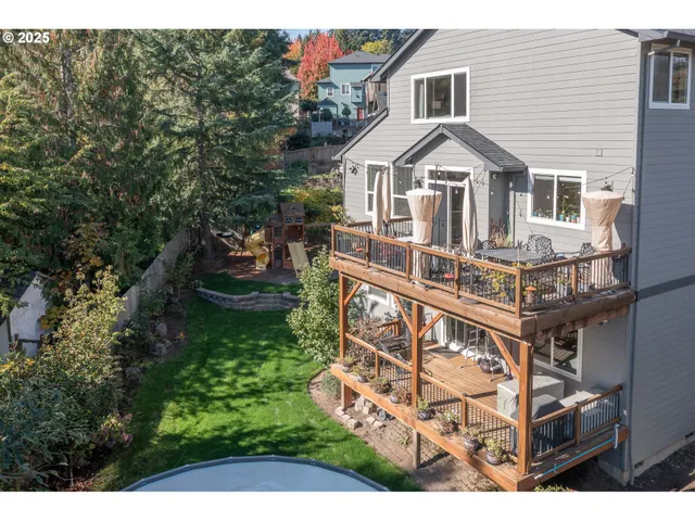 a view of a house with yard and sitting area
