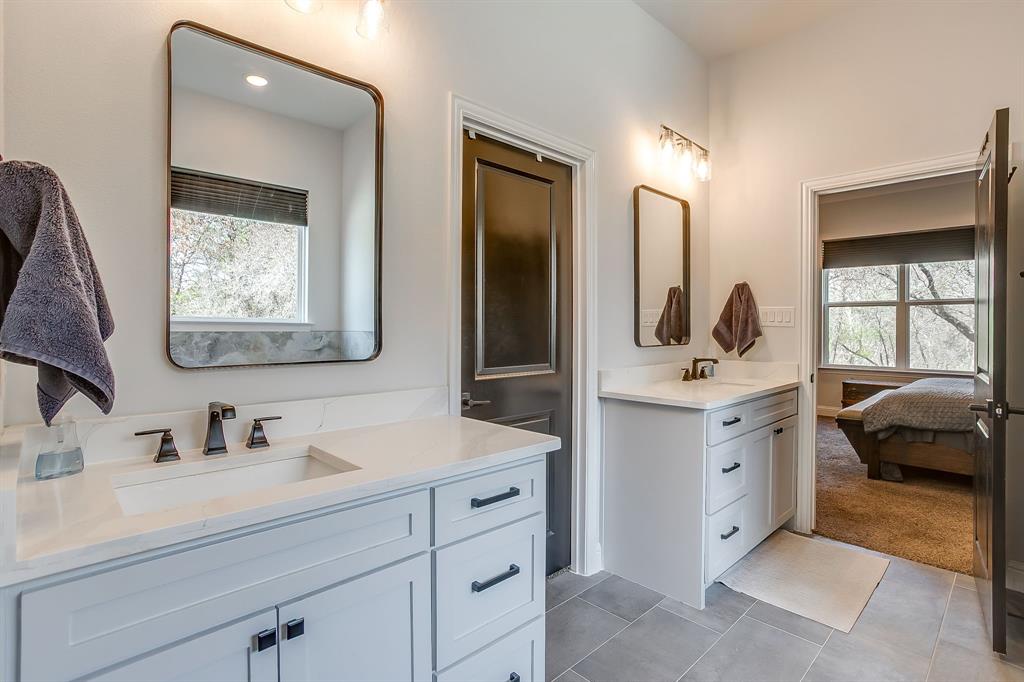 1040 Rose Court Nemo, TX 76070 - Photo 25 of 40 a en suite bathroom with a double vanity sink mirror and window