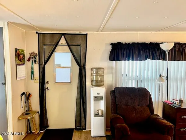 a view of hallway with furniture and a window
