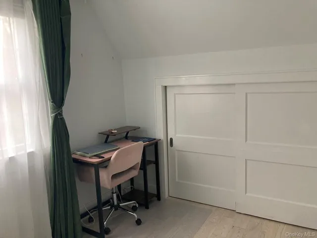 a view of a workspace with furniture