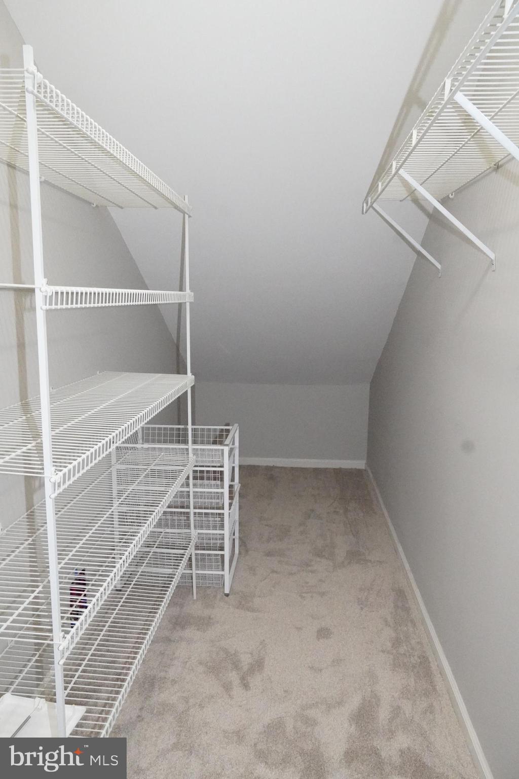 7308 B Normandy Drive Mount Laurel, NJ 08054 - Photo 15 of 23 a view of an empty room with racks on the wall