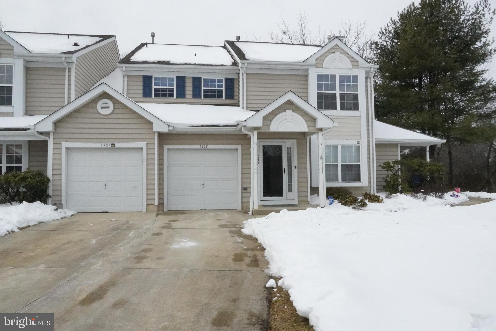 7308 B Normandy Drive Mount Laurel, NJ 08054 - Photo 23 of 23 a view of a white house with a large tree