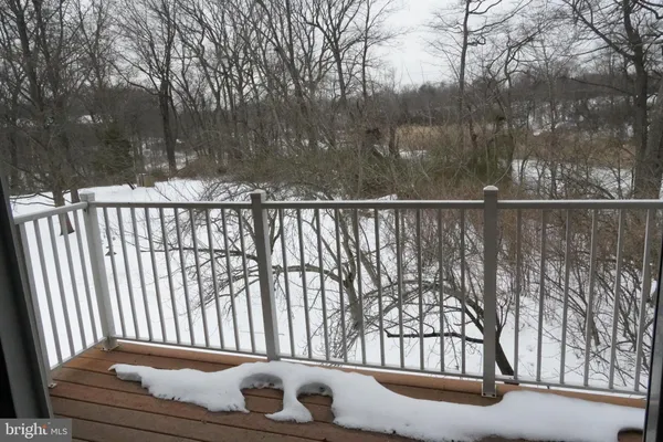 a view of a house with backyard and trees