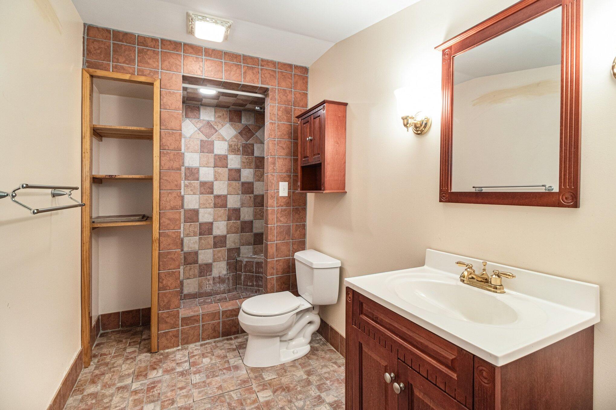 9082 Dallas Place Crown Point, IN 46307 - Photo 18 of 20 a bathroom with a sink toilet and shower