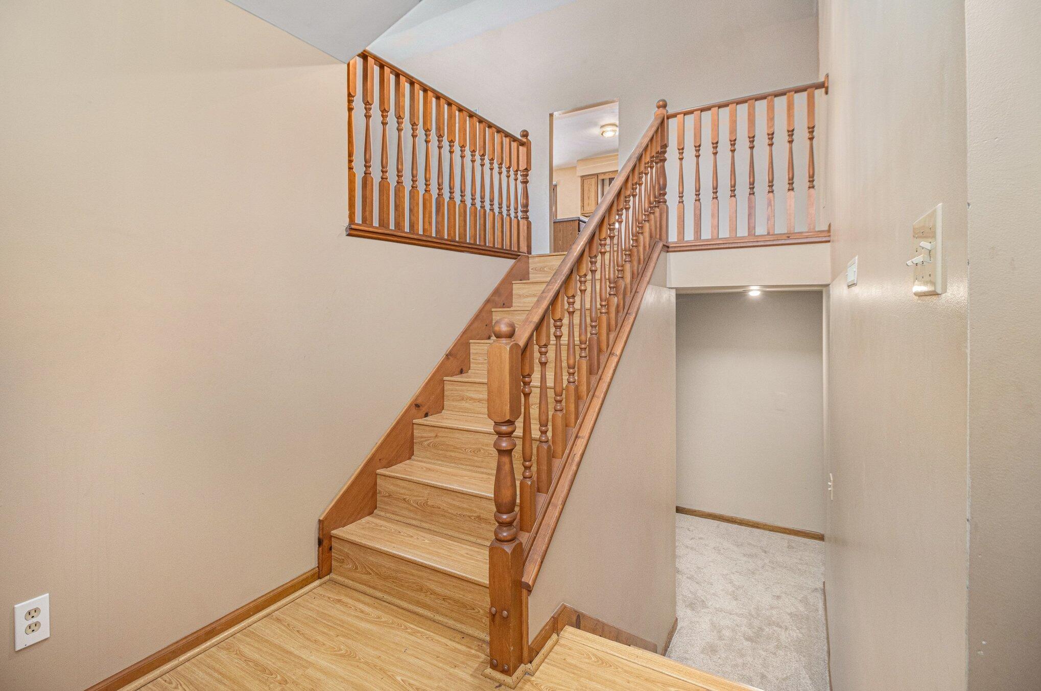 9082 Dallas Place Crown Point, IN 46307 - Photo 2 of 20 a view of staircase with white walls and a window
