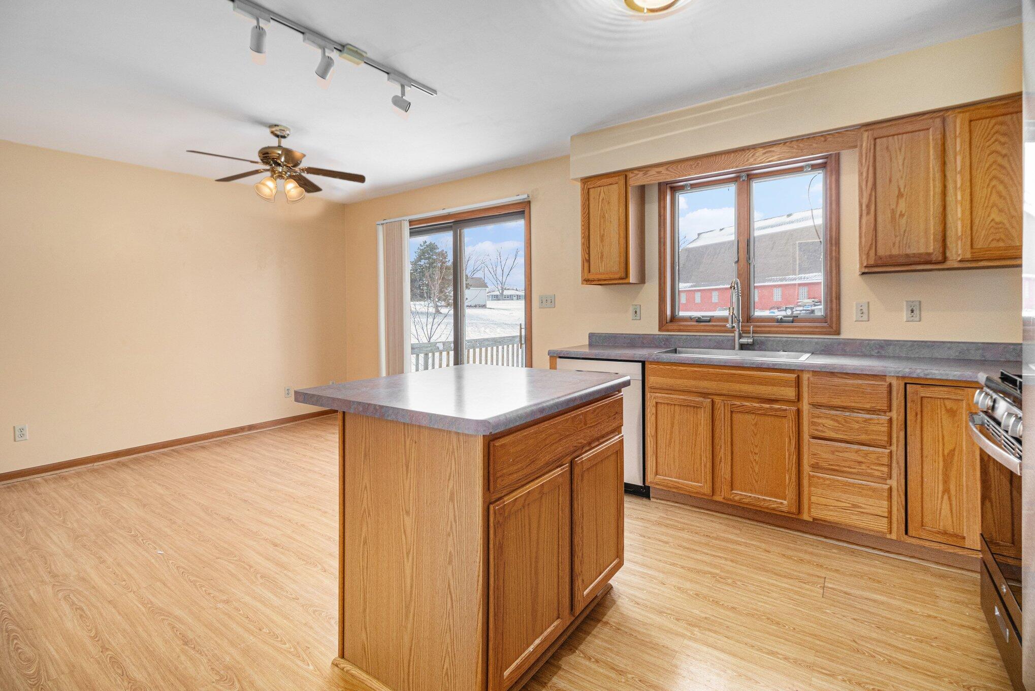 9082 Dallas Place Crown Point, IN 46307 - Photo 6 of 20 a kitchen with stainless steel appliances granite countertop a sink a stove and a refrigerator