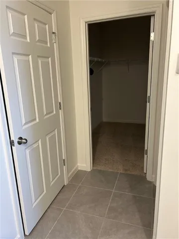 a bathroom with a granite countertop sink shower and a mirror