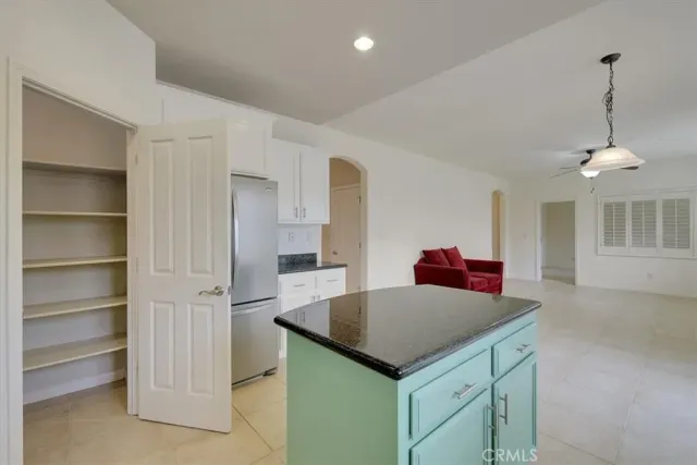 a kitchen that has a cabinets and a table in it