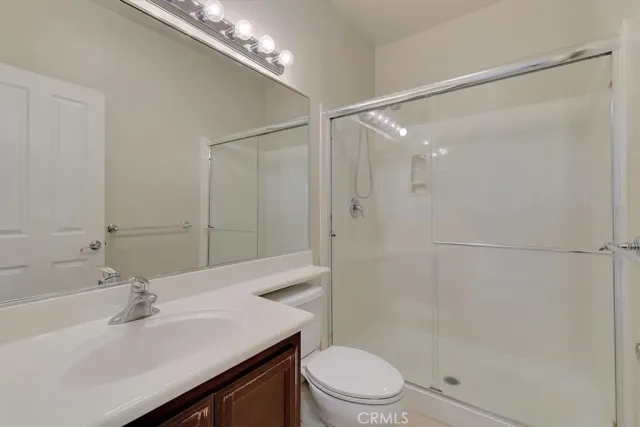 a bedroom with a bed and lamp