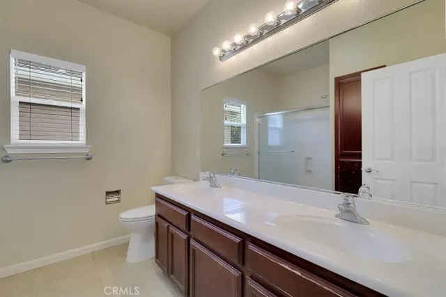 a utility room with sink dryer and washer