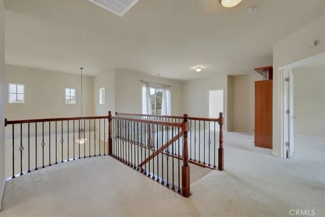 a spacious bedroom with a bed and a couch