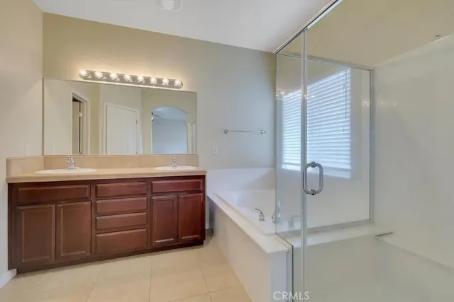 a view of a house with a small yard and deck