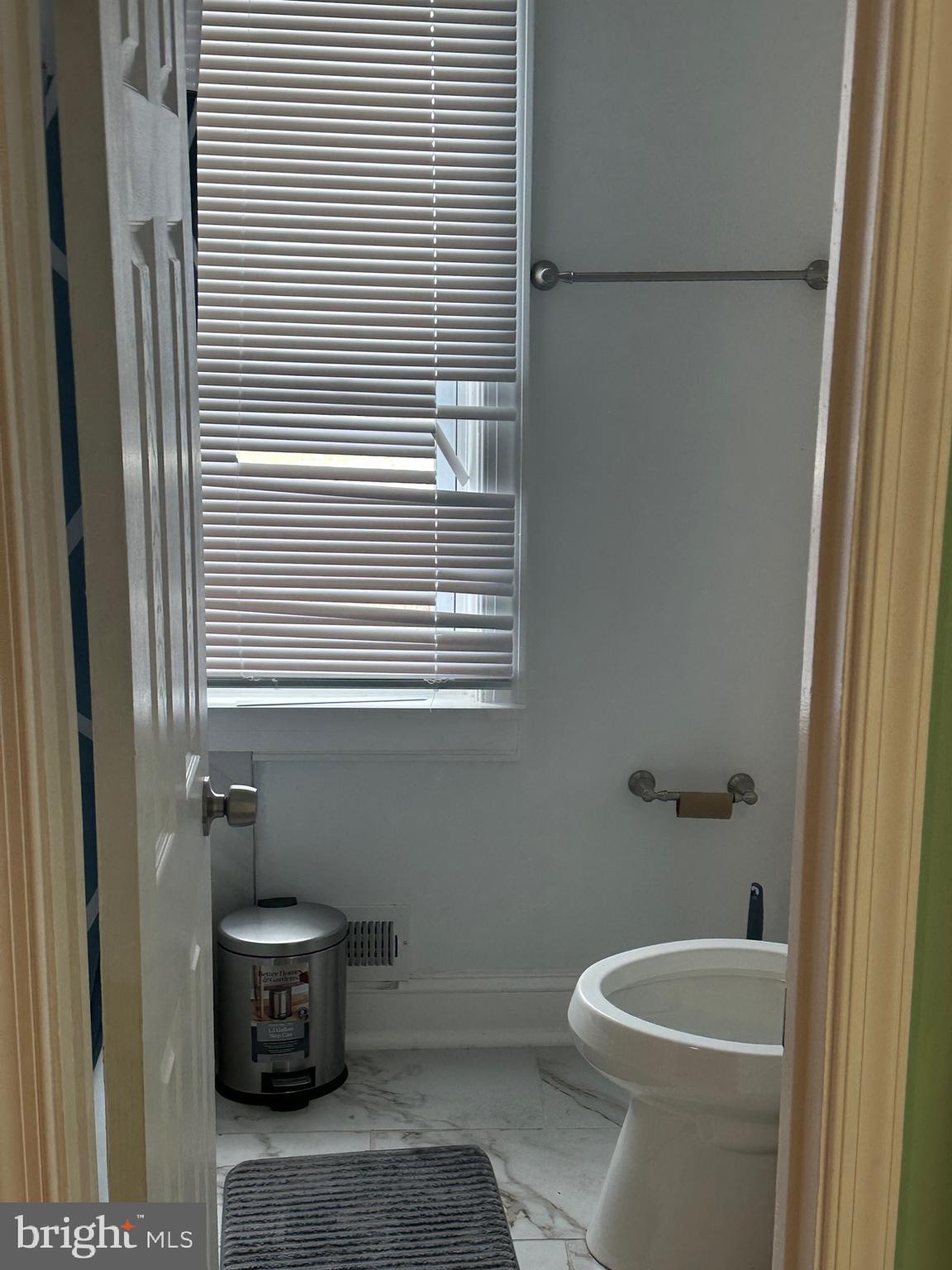 5904 K Street Capitol Heights, MD 20743 - Photo 11 of 30 a bathroom with a toilet and a sink