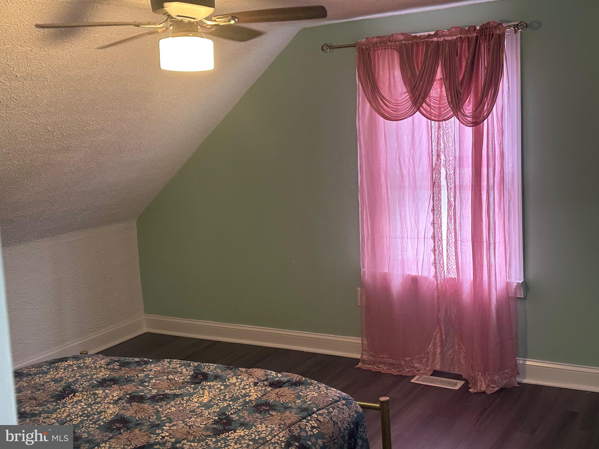 5904 K Street Capitol Heights, MD 20743 - Photo 12 of 30 a room with a bed and a chair