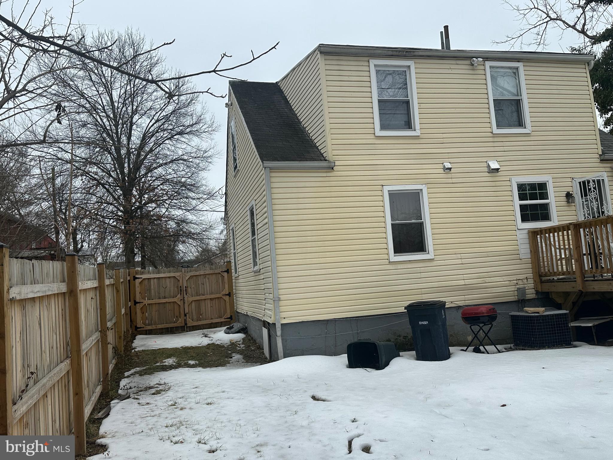 5904 K Street Capitol Heights, MD 20743 - Photo 25 of 30 a view of a house with a yard and wooden fence